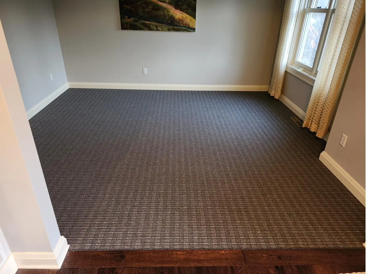 Charcoal geometric carpet — home office, installed by QFI