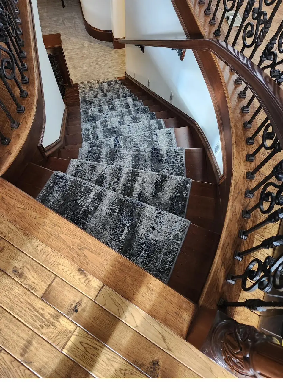 Patterned carpet — curved staircase, installed by QFI