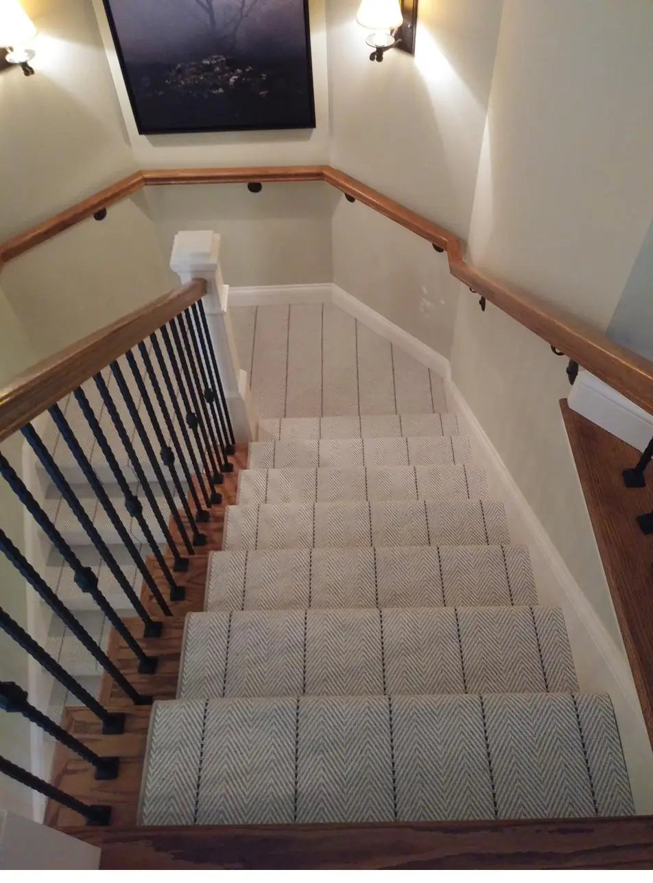 Warm beige carpet — descending stairs, installed by QFI