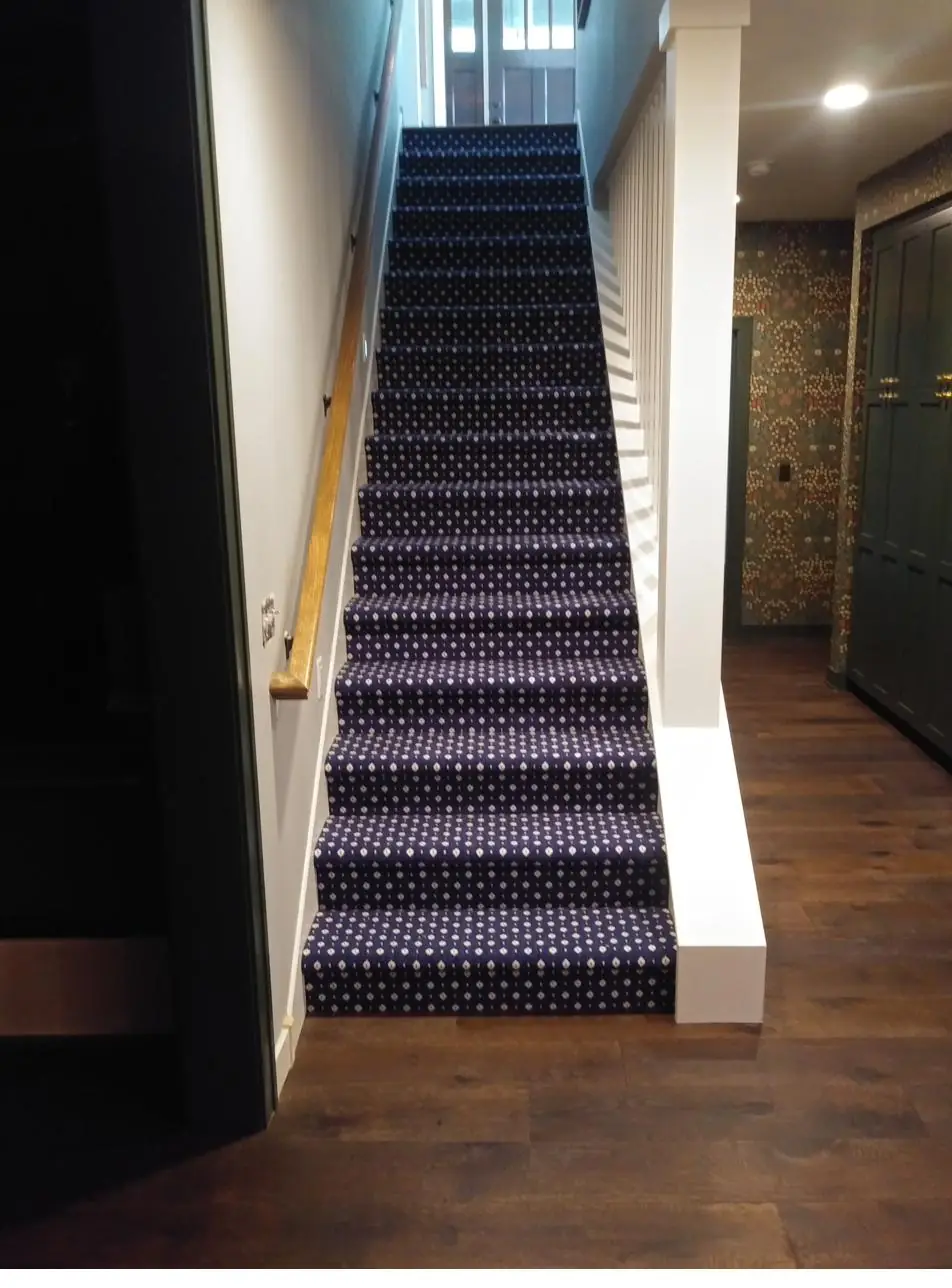 Dark patterned runner — modern staircase, installed by QFI