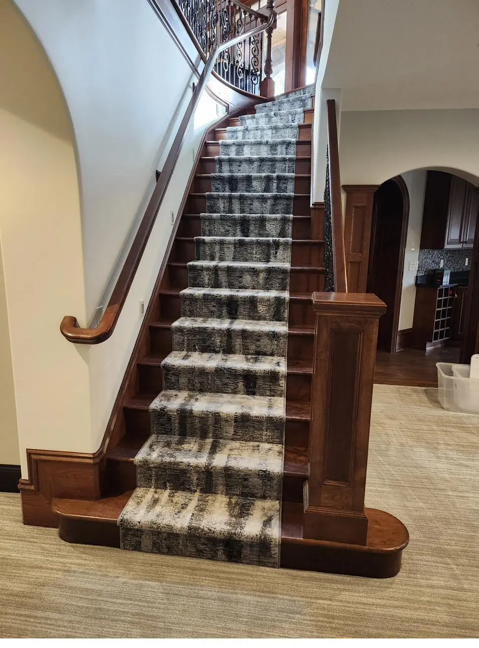 Deep-tone carpet — long staircase, installed by QFI