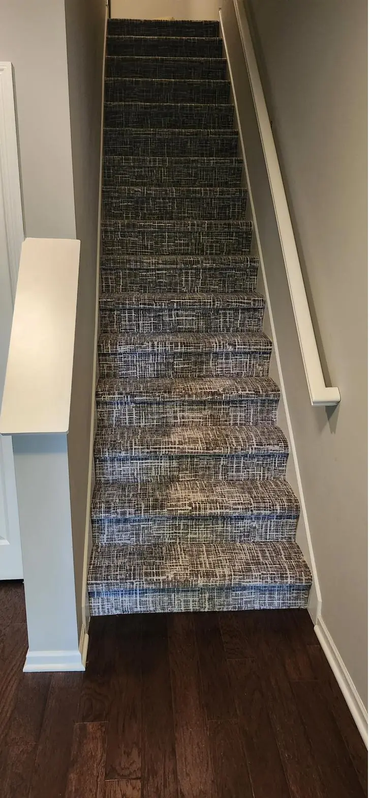 Textured charcoal runner — staircase, installed by QFI