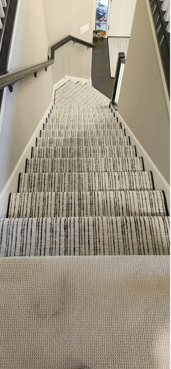 Gray striped runner — staircase turn, installed by QFI