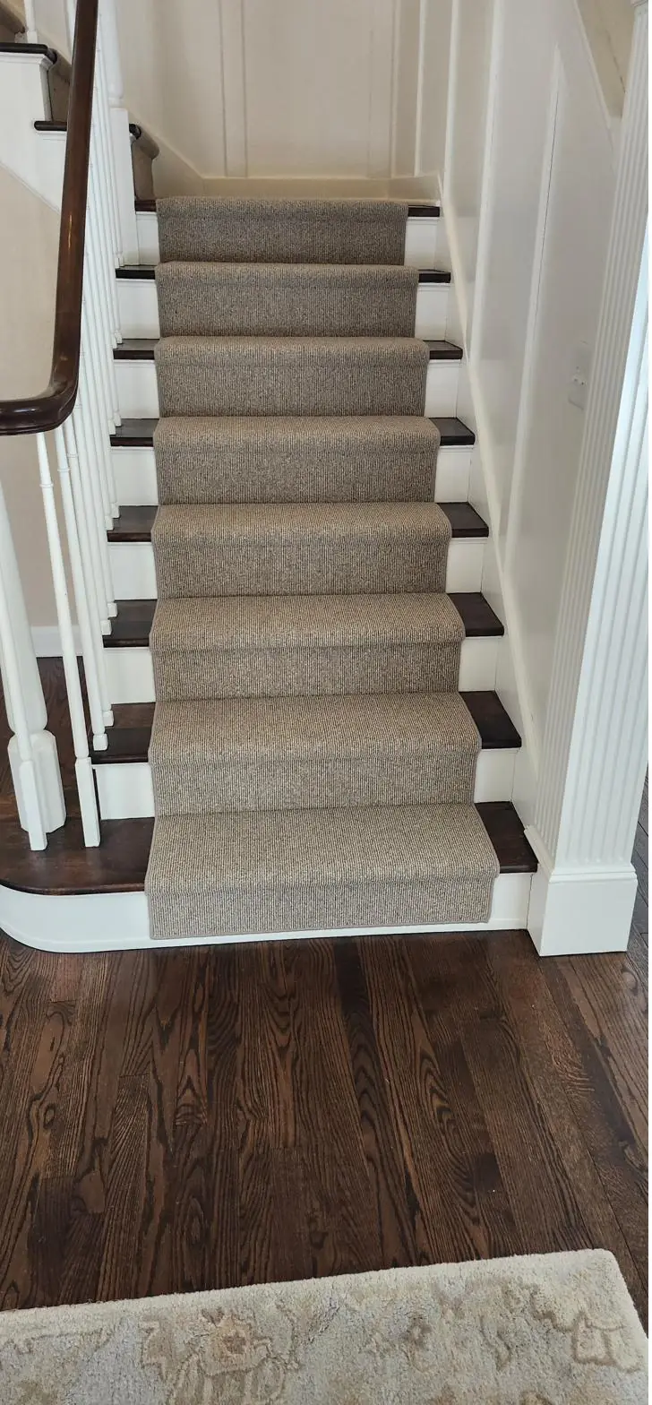 Deep-tone carpet — stairs to wood hall, installed by QFI