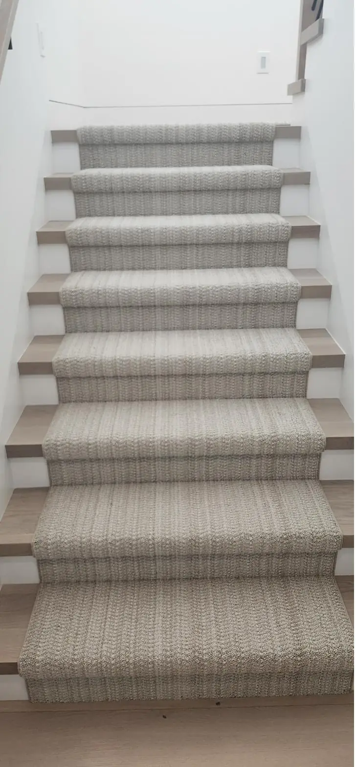 Light patterned carpet — staircase, installed by QFI